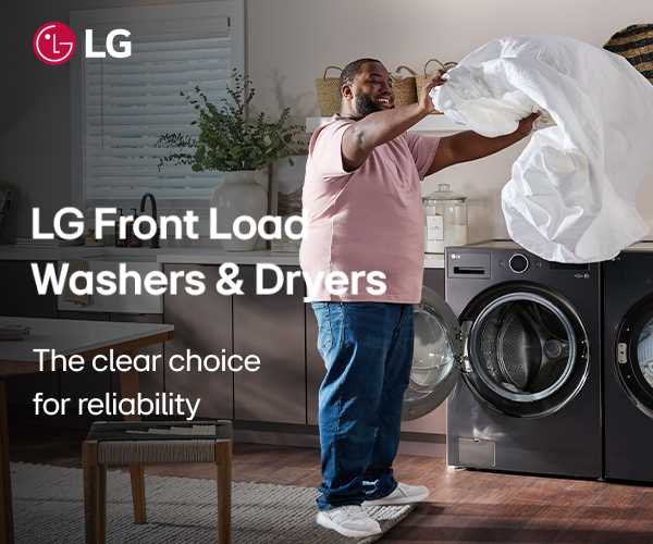 Man drying sheets using LG Front Load Washer and Dryerc